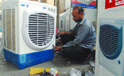 Workers prepare coolers at a market in New Delhi as temperature in the Capital reached 45.4 degree Celsius on Monday.