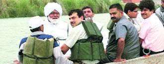 Chief Parliamentary Secretary Jaleb Khan (in a turban), along with the DC and ADC, monitors a training camp in the western Yamuna in Yamunanagar on Monday.