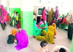Patients waiting for doctors at regional hospital in Hamirpur on Monday