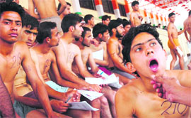 Candidates undergo medical check-up at a recruitment rally of the Indian Air Force at MA Stadium in Jammu on Monday.