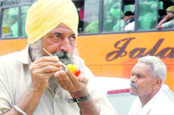 A man has ice candy on a hot Monday afternoon in Bathinda