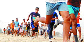 Candidates run during an Army recruitment rally at Khasa in Amritsar 