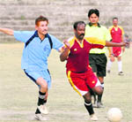 A player in action at a match during the Institutional League Football Tournament in Dehradun