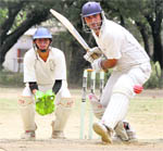 A batsman faces a delivery at a match during the Kanta Devi Raghav Memorial National Cricket Tournament in Dehradun 