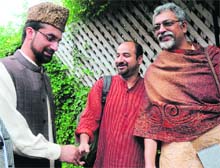 Amnesty International team members Bikramjeet J Batra (centre) and Ramesh Gopal Krishan meet Hurriyat Conference Chairman Mirwaiz Umar Farooq in Srinagar on Tuesday.