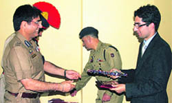 DGP Kuldeep Khoda felicitating Shah Faesal in Srinagar.