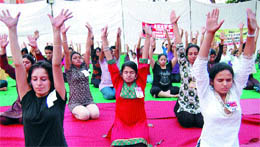 Students practise yoga during a camp organised by the Art of Living at 