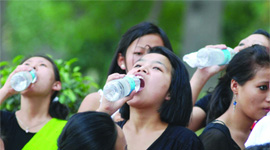 Girls quenching their thirst in New Delhi on Wednesday.