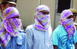 The three men involved in cheating bank customers in New Delhi on Wednesday.