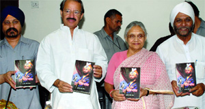 Chief Minister Sheila Dikshit releases a book Sant Kavi Guru Govind Singh written by Surjeet Singh Joban at Delhi Secretariat on Wednesday.