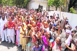 Sanitation workers protest against the Health Officer for non-payment of their mela duty dues in Haridwar on Wednesday.