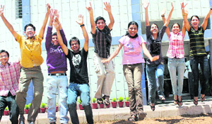 Students jump with joy after their success in CBSE Class XII results in Gurgaon on Wednesday.