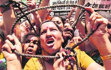 BJP activists raise slogans demanding execution of Afzal Guru in New Delhi on Wednesday. 