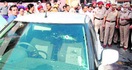 The bullet-riddled car used by the assailants in a shootout in Amritsar on Wednesday