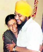 Gurinderbir Singh along with his mother at their residence in Amritsar on Wednesday