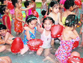 Tiny tots of DAV Public School, Phase X, Mohali, have a ball at a pool party.