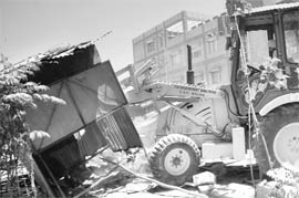 A demolition drive being carried out by GMADA at Phase XI, Mohali, on Thursday.