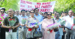 Members of Delhi Petrol Dealers Association hold a peaceful protest outside the Chief Ministers residence for parity in VAT on diesel in Delhi with the NCR in New Delhi 
