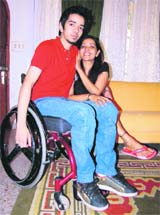 Aruj Singh, who met with an accident and was paralysed from the waist below, with his mother Aruna Singh after passing the class XII examinations in Dehradun on Wednesday.