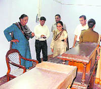 Uttarakhand Governor Margaret Alva examines antique furniture at the Raj Bhawan in Nainital on Thursday.