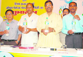 Uttarakhand Agriculture Minister Trivender Singh Rawat launches Anchal brand of water in Dehradun on Thursday.