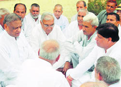 Chief Minister Bhupinder Singh Hooda during his visit to Khokri village in Jind.