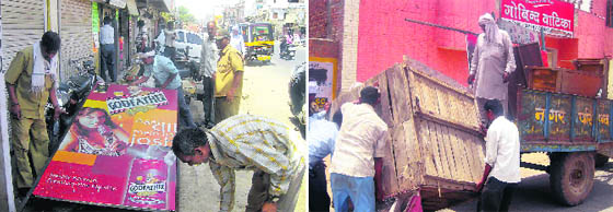 Employees of the Panipat Municipal Corporation carry out an anti-encroachment drive in the city.