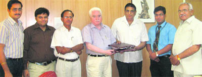 University registrar RK Arora and BK Sharma while signing the pact in the presence of VC HS Chahal (extreme right).
