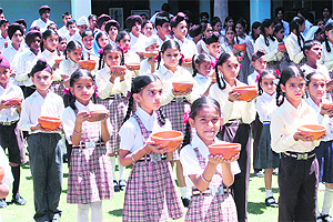 Students of Future Pack Higher Secondary School take a pledge to save birds in Jammu on Thursday.