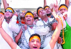 Members of the Hindu Jagriti Manch protest in front of the DCs office in Jalandhar on Thursday.