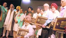 Deputy Chief Minister Sukhbir Singh Badal with Shiromani Awardees-2009 at a function in Chandigarh on Thursday.