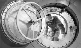 A technician participating in the Mars500 experiment, which simulates a 520-day flight to Mars, is seen at a confinement module in Moscow.