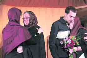 Cindy Hickey (right), mother of Shane Bauer, and Nora Shourd, (second left), mother of Sarah Shourd, hug their children in Tehran on Thursday. Iran detained three Americans along the Iraqi border and have accused them of spying