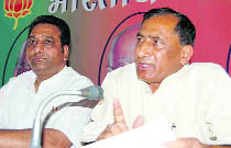 Uttarakhand BJP chief Bishan Singh Chufal (right) addresses the media in Dehradun on Friday. 