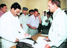 Chief Minister Ramesh Pokhriyal Nishank during a sudden inspection of Dehradun tehsil office on Friday. 