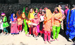 Kids wait for the conclusion of the NSUI function in the gallery of Abhinav Theatre in Jammu