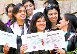 Students of SCD Government College with their degrees in Ludhiana on Friday
