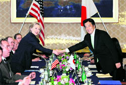 US Secretary of State Hillary Rodham Clinton (left) shakes hands with her Japanese counterpart Katsuya Okada before their meeting at the Foreign Ministry's Iikura guesthouse in Tokyo on Friday. Clinton kicked off a three-nation tour of Asia on Friday that was supposed to focus on US-China economic issues but is being overshadowed by a crisis over North Korea's sinking of a South Korean warship.