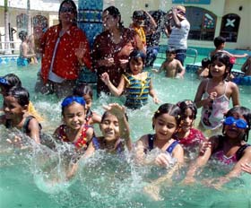 Students of the Millennium School having fun in a swimming pool during the 'Bathinda Beach Blast' celebrations on Friday.