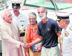 Vice-President Hamid Ansari shakes hands with Commander Dilip Donde, the first Indian to undertake solo circumnavigation of the globe on a sail boat, on his arrival in Mumbai on Saturday.