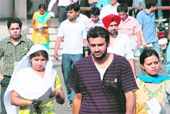 IAS aspirants come out of the examination centre at Government College, Sector 46, Chandigarh, on Sunday. 