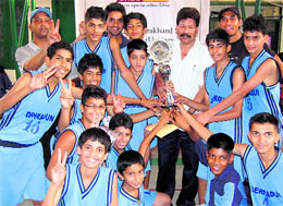 Doon boys receive the trophy after winning the tourney