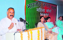 Shamsher Singh Manhas,president of the J&K BJP,addresses party workers during a function of the Mahila Morcha in Jammu on Sunday