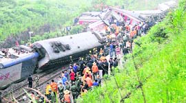 Rescue workers at the site where a passenger train derailed in Dongxiang County, east China's Jiangxi Province, on Sunday.
