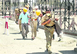 Rescue workers participate in a mock drill organised on the premises of Panipat IOC refinery.