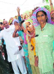 Dalits of Songri village hold a protest in Kaithal on Monday.