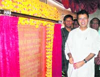 Public Health Minister Randeep Surjewala lays the foundation stone of a library in Kaithal.
