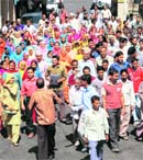 Villagers of Beerta near Kangra protest against x-Congress minister GS Bali and his son Raghubeer Singh Bali at Dharamsala on Monday. 