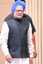 PM Manmohan Singh arrives to attend a press conference in New Delhi on Monday.