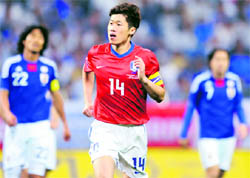 South Koreas midfielder Park Ji-Sung (C) reacts after scoring his team's first goal against Japan during their international friendly at Saitama Stadium, in suburban Tokyo, on Monday